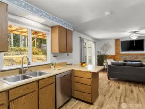 Central kitchen connecting multiple rooms.