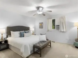 Primary bed and bath with ac unit.
