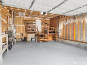 Large multi-vehicle garage with high ceilings.