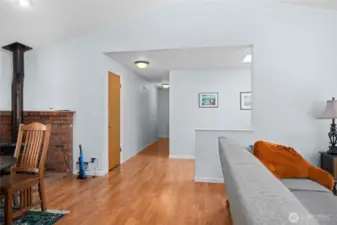 Hallway to bedrooms. First door on right leads to laundry area and then garage.