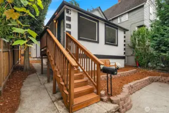 Side yard leads to backyard and storage under the house.