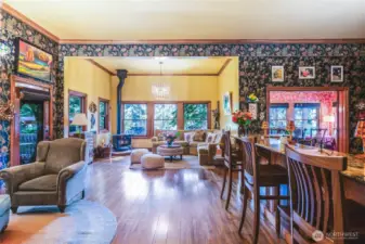Great room with wood stove and entry to deck