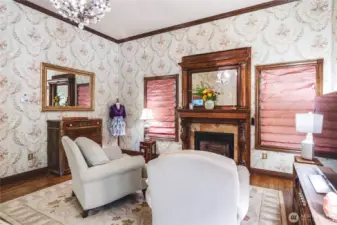 Primary suite sitting area with gas fireplace