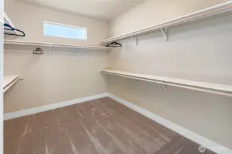 Wardrobe closet off of primary bathroom