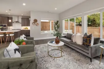 Expansive windows fill the living room with natural light.