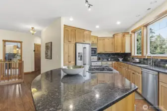 Chefs kitchen with Stone countertops, Custom Hickory Cabinets, Stainless Steel appliances, cook with amazing views.