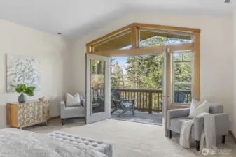 Primary Bedroom with French doors leading to the private deck.