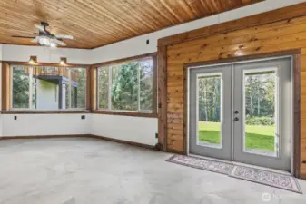 Covered Patio with at stone bar at the large window in the corner.