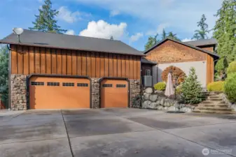 3 car attached garage, with second level storage.