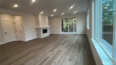 View from kitchen area to back deck.  Private lot off deck.