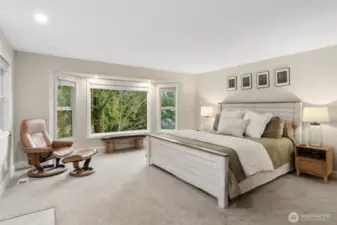 Primary bed with access to covered back deck.