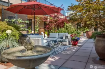 Extensive tiled patios and container gardens on three levels!