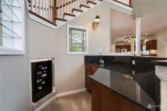 Wet bar in the great room. The wet bar has a fully functioning sink with hot/cold water. There is great storage in the wet bar area and room for a beverage refrigerator. Under the staircase is a recently redone storage area. The storage area has new carpet and baseboards. A great place for storing items or for a playroom.