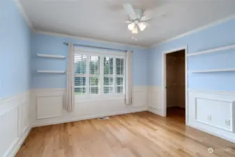 Bedroom #3 features hardwood floors, wainscoting and newer custom shutters. It also features a large walk in closet and ceiling fan. Bedroom #3 connects to a Jack and Jill bathroom (full bath).