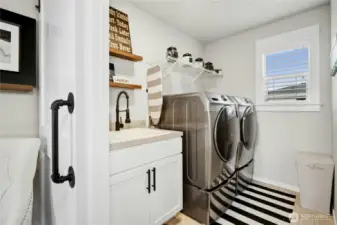 Upstairs laundry room with barn door (W/D stays!)