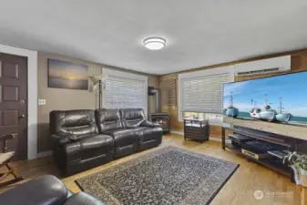Living room has pretty wood floor.