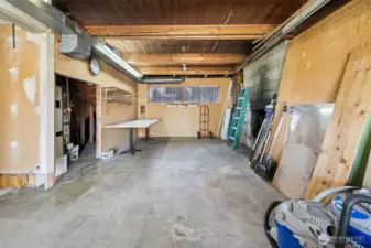 This could be a finished family or rec. room.  Wood burning fireplace and sliding glass door to backyard.  Finish the spaces on the lower level to build sweat equity: family room, laundry and 3/4 bath and possible 4th bedroom behind the garage.