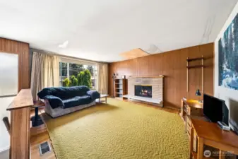 Original finishes from 1964 including hardwood floors throughout upstairs living, hallway, bedrooms and closets which have been protected by carpeting most of the years.  Wood burning fireplaces one on each level. 3 bedrooms and full bath upstairs.