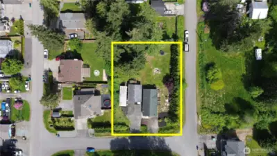 Drone view of the house located on a huge lot,  and  view of the neighborhood.