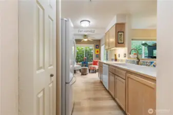 Another view of the kitchen showing the pantry doors.