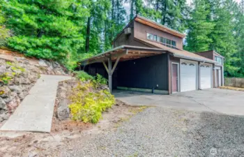 Another carport--detached two car garage and shop with a loft room above. Loft room formerly used as an office space