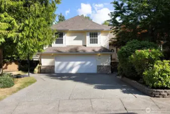 Deep two car garage and wide drive way can accommodate parking many cars