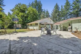 Oversized patio and rear view of home and ADU