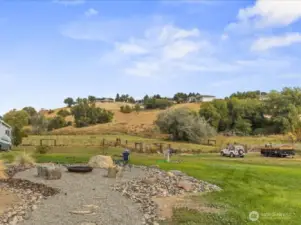 Back yard with awesome firepit area for entertaining or star gazing.