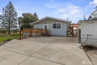 Back entry from private deck or lower level to mud room on the left. Huge patio area. structure to the right is new water treatment shed
