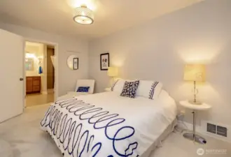 Primary bedroom with primary bathroom and walk in closet