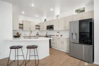 This beautiful kitchen was renovated last year. You simply have to see the cabinet color in person- it's unique and gorgeous with premium and hard-to-find pulls