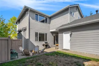 The garage features a walk-out door to the backyard