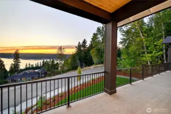View from main floor deck under covered area coming off the library/office/bonus room to the left of the home off the entry looking North West.