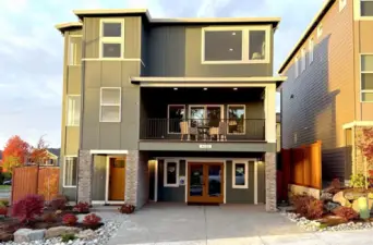 The Glacier Home Plan. All photos, renderings, site maps, and floorplans are for visualization purposes only. Plans, colors, building orientation, finishes, home outlook, and other details can and WILL vary. Striking three-level Glacier plan showcases a modern Craftsman façade with brick accents, vertical siding, and oversized windows for maximum natural light. Covered balcony and welcoming entry set the tone for refined living in Bothell’s Foxmoore community, close to Canyon Park conveniences and I-405 access.