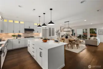 Kitchen & Great Room Overview: Oversized island overlooks dining and great room, showcasing the seamless connection between spaces. Ideal for hosting or daily routines, the design emphasizes flexibility, light, and comfort in a sought-after Eastside location.    Photos are from THIS model home at Foxmoore but are for visualization purposes only.  Photos are from the model home at Foxmoore and for visualization purposes only. Plans, colors, building orientation, finishes, home outlook, and other details can and WILL vary.