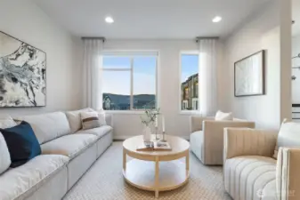 Generous main floor living with custom TV wiring.