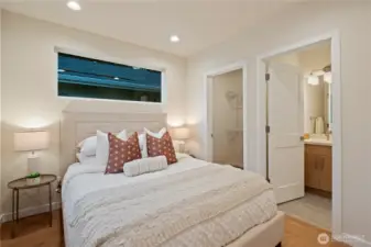 First of two suites upstairs features a full bath and walk-in closet.