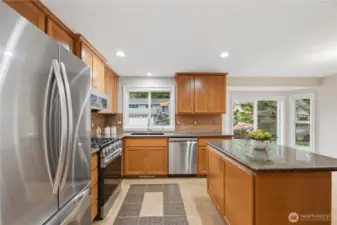 kitchen island with pull out garbage and recycle bins