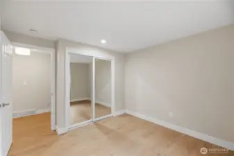 2nd Upstairs bedroom with mirrored closet and large window