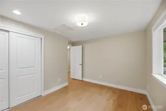 3rd Bedroom upstairs with large window all new closet doors, lighting