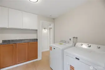 Huge utility room with built in cabinets