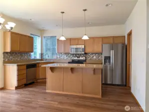 Center Island in Kitchen.  Seller did have small dining table in front of slider under chandelier