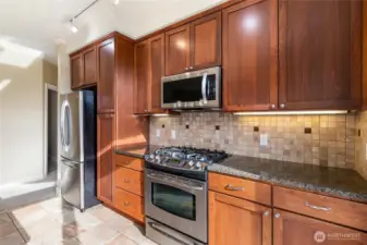 Stainless steel appliances and granite countertops.