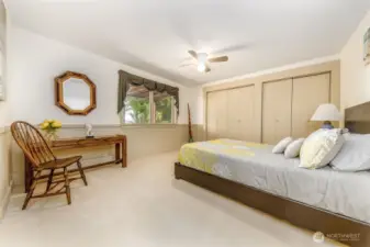 Ground level bedroom looks out to garden and firepit area.