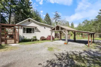 Carport near rear entry steps.
