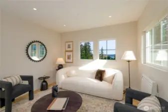 main level entry family seating room with water views