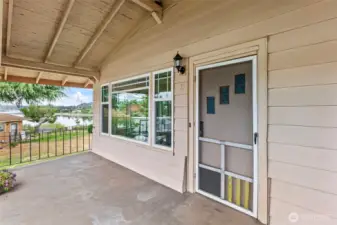 Covered front porch looking toward the water.