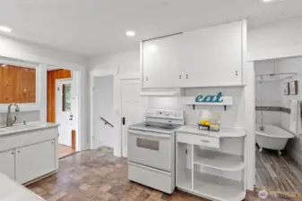 Opposite wall of kitchen, small pantry to left of stove and solarium to the left.