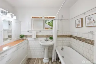 Remodeled bathroom retained it's vintage charm. Claw foot bath, period drawer pulls and cabinetry and floors are radiant heated.
