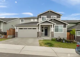 Modern curb appeal in the heart of McCormick Trails — Clean lines, fresh exterior colors, and a welcoming covered entry set the tone for style and comfort throughout.